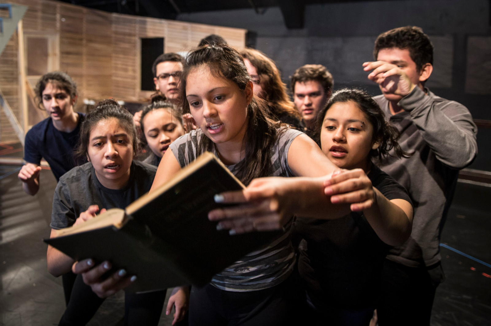 Lizbeth Acevedo (center) and APTP ensemble members rehearse a scene from God's Work. (Photo: Liz Lauren)